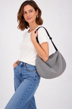 The In.Zu Bean Bag White Interstellar Hive features a relaxed crescent shape, textured dot design and adjustable shoulder strap.