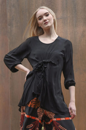 Front view of the World of Wonders top in lightweight 'Sheer Luck' viscose crepe featuring a scoop neckline and ruched center detail.