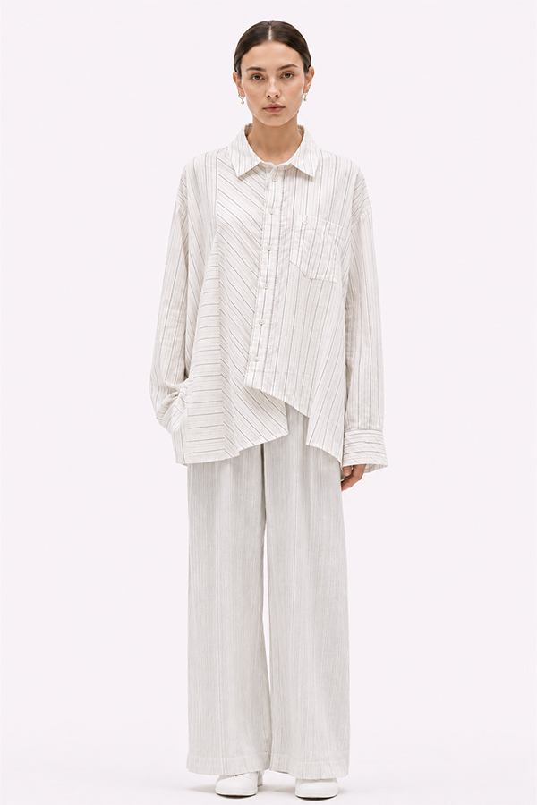 Off-white relaxed fit shirt by La Vaca Loca featuring a unique diagonal front closure and chest pocket.