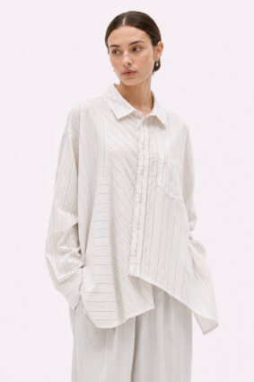 Off-white relaxed fit shirt by La Vaca Loca featuring a unique diagonal front closure and chest pocket.