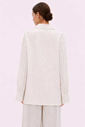 Off-white relaxed fit shirt by La Vaca Loca featuring a unique diagonal front closure and chest pocket.