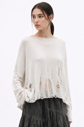 La Vaca Loca Libido oversized off-white knitted top with boat neckline and deconstructed sheer openings.