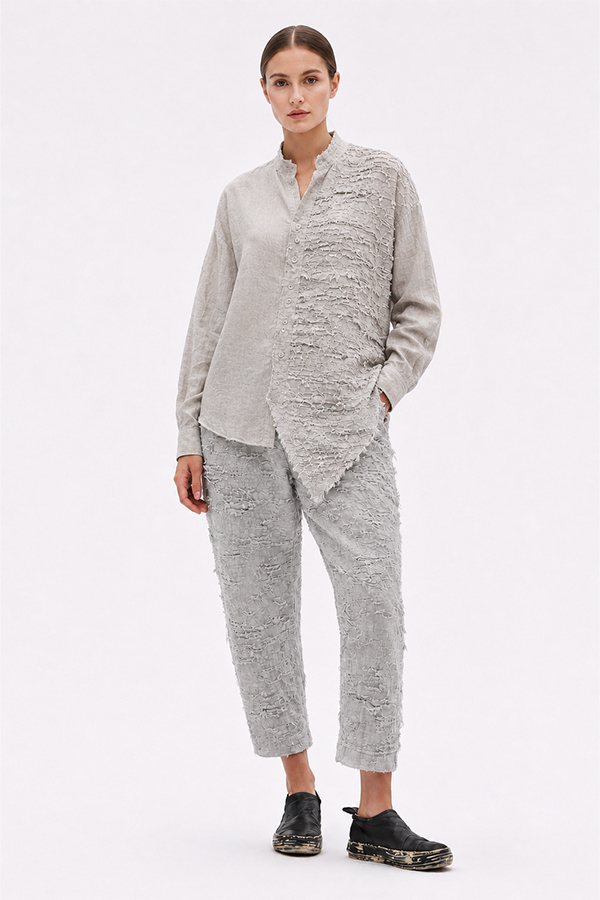 La Vaca Loca Salvd loose-fit asymmetrical shirt in cold white distressed cotton voile fabric with a stand-up collar.