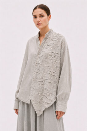 La Vaca Loca Salvd loose-fit asymmetrical shirt in cold white distressed cotton voile fabric with a stand-up collar.