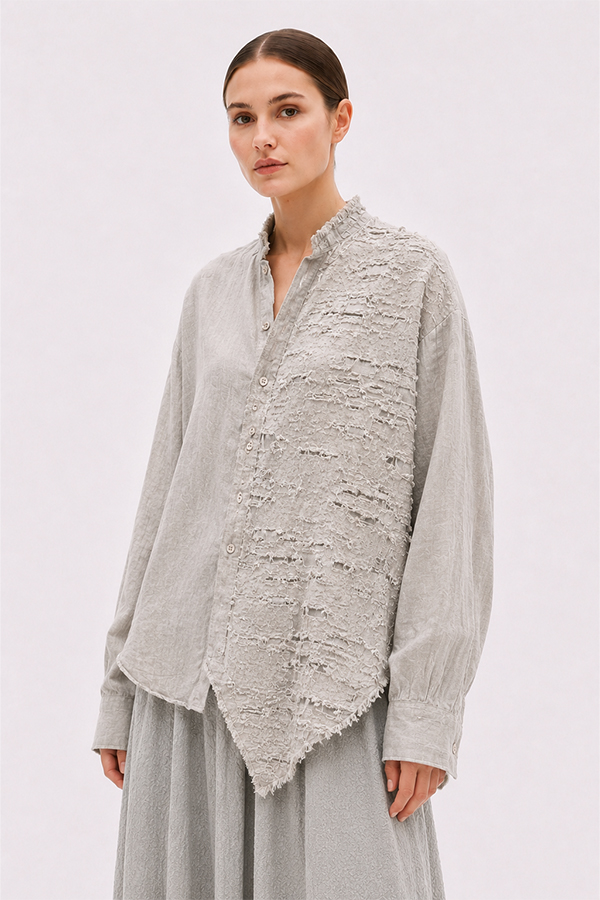 La Vaca Loca Salvd loose-fit asymmetrical shirt in cold white distressed cotton voile fabric with a stand-up collar.