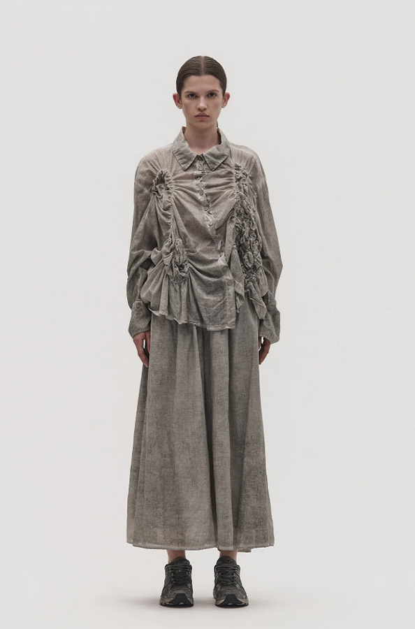 La Vaca Loca Somatico oversized long-sleeved shirt in cold black voile fabric with irregular front gathers.