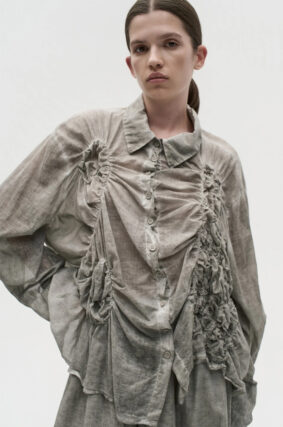 La Vaca Loca Somatico oversized long-sleeved shirt in cold black voile fabric with irregular front gathers.