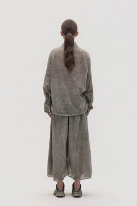La Vaca Loca Somatico oversized long-sleeved shirt in cold black voile fabric with irregular front gathers.