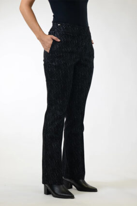 Woman wearing Lisette Onyx Crosshatch Mini Flair ankle-length pants in Black Charcoal with a dark long-sleeve knit top