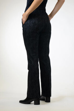 Woman wearing Lisette Onyx Crosshatch Mini Flair ankle-length pants in Black Charcoal with a dark long-sleeve knit top