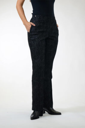 Woman wearing Lisette Onyx Crosshatch Mini Flair ankle-length pants in Black Charcoal with a dark long-sleeve knit top