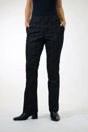 Woman wearing Lisette Onyx Crosshatch Mini Flair ankle-length pants in Black Charcoal with a dark long-sleeve knit top