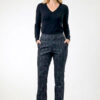 Woman wearing Lisette Onyx Crosshatch Mini Flair ankle-length pants in Black Charcoal with a dark long-sleeve knit top