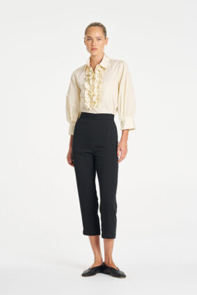 Mela Purdie Ruffle Resort Top in Vanilla, an elegant long sleeve shirt with statement ruffle detailing for women