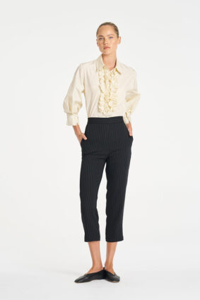 Mela Purdie Ruffle Resort Top in Vanilla, an elegant long sleeve shirt with statement ruffle detailing for women