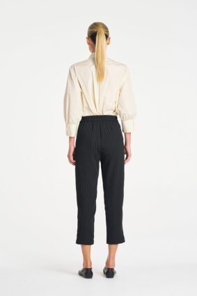 Mela Purdie Ruffle Resort Top in Vanilla, an elegant long sleeve shirt with statement ruffle detailing for women