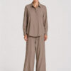 Model wearing Mela Purdie Suit Pant in Almond with a matching long-sleeve blouse.