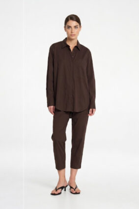 Model wearing Mela Purdie Zip Tapered Pant in Fudge brown with matching blouse.
