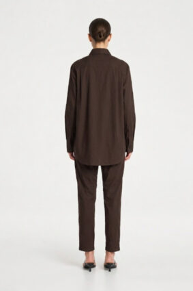 Model wearing Mela Purdie Zip Tapered Pant in Fudge brown with matching blouse.