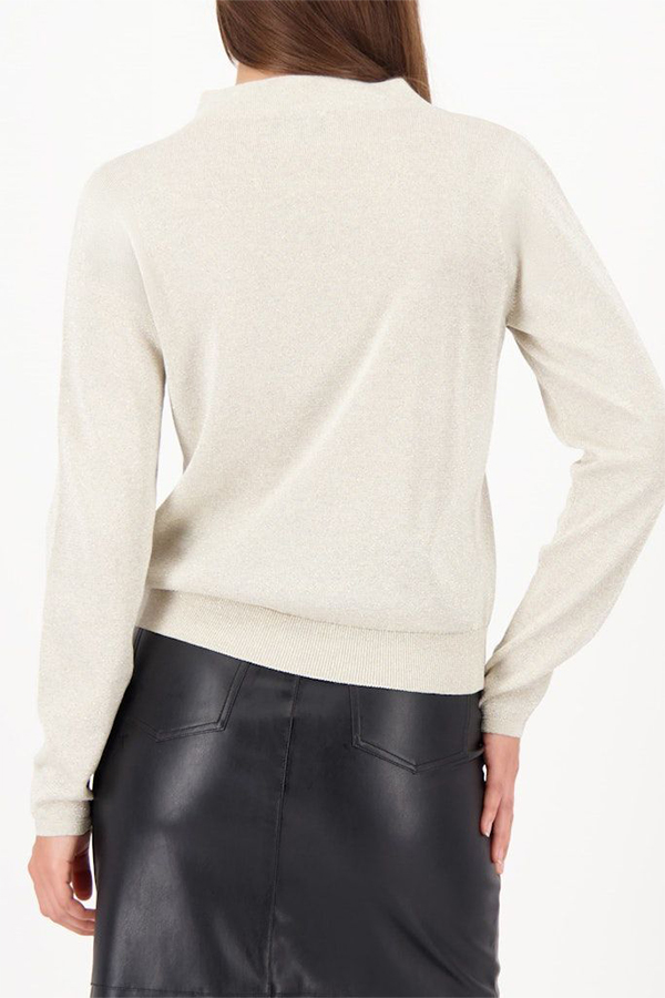 Model wearing a Monari Cut-Out Sweater in Almond beige knit with a high neckline.