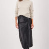 Model wearing a Monari Cut-Out Sweater in Almond beige knit with a high neckline.
