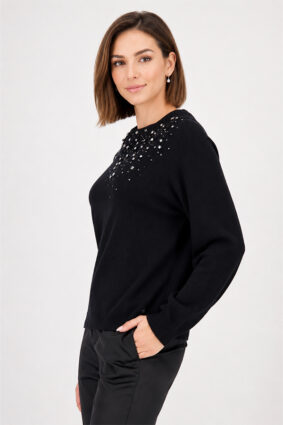 Monari black sweater with gem details worn by a model to showcase the refined silhouette.