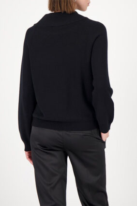 Monari black sweater with gem details worn by a model to showcase the refined silhouette.