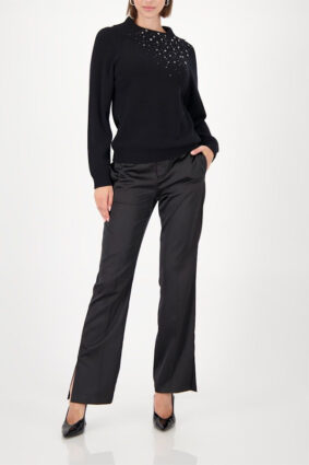 Monari black sweater with gem details worn by a model to showcase the refined silhouette.