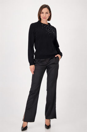 Monari black sweater with gem details worn by a model to showcase the refined silhouette.