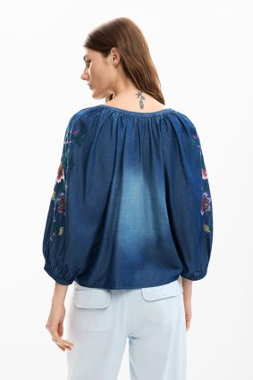 Desigual Embroidered Balloon Blouse Azul Marea front view showing soft washed blue fabric and flowing silhouette