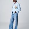 Herzens Blouse Aurora Multi striped button-through shirt with floral chest pocket and back yoke detail.Herzens Blouse Aurora Multi striped button-through shirt with floral chest pocket and back yoke detail.