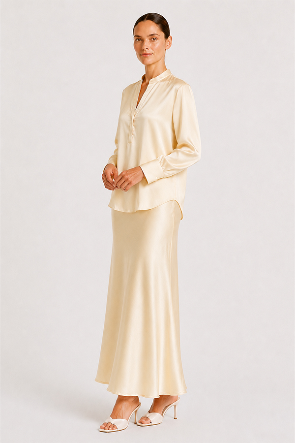 Blouse Mozarella elegant soft off-white silk blouse with a refined split neckline, fluid drape, and wide cuffs.