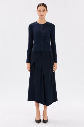 Model wearing the navy blue High Tech Guipure Jacket, featuring a slim, cropped fit with open-work guipure inserts and a sporty-chic design.