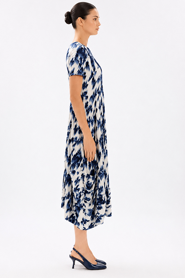 Model wearing the High Tech Mesmerize Dress 002, featuring an elegant shaded natural print, crewneck, and an irregular hem.
