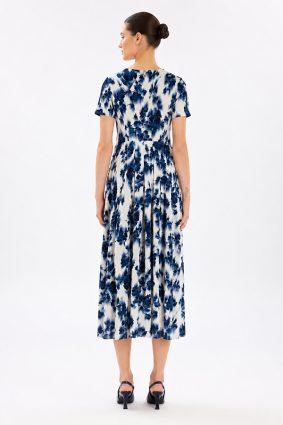 Model wearing the High Tech Mesmerize Dress 002, featuring an elegant shaded natural print, crewneck, and an irregular hem.