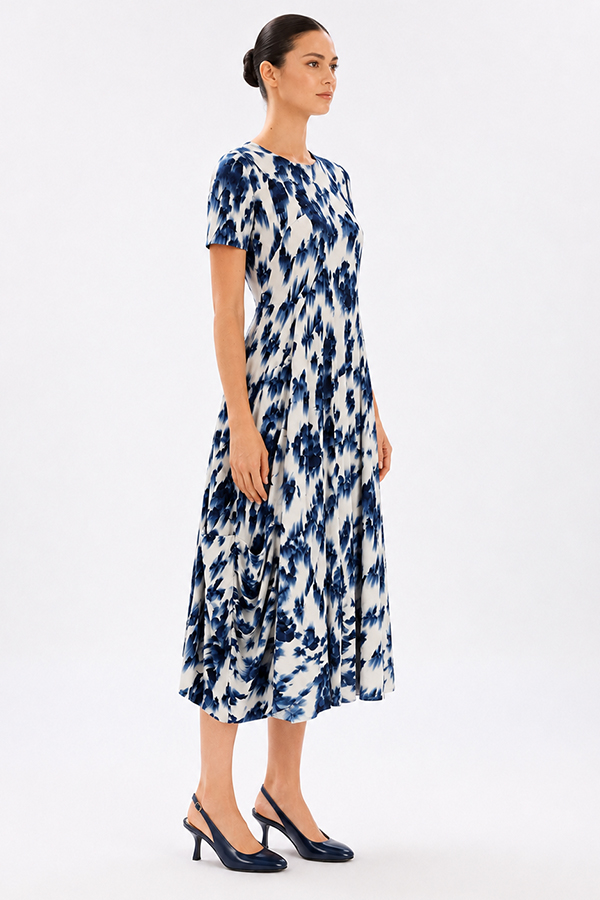 Model wearing the High Tech Mesmerize Dress 002, featuring an elegant shaded natural print, crewneck, and an irregular hem.