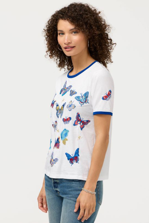 Johnny Was Contrast Binding T-Shirt Vanny in white featuring blue contrast neck and sleeve binding with embroidered butterflies and floral motifs.