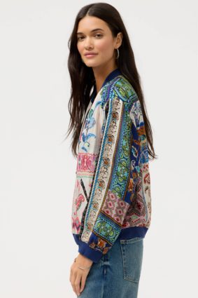 Johnny Was Kim Bomber Jacket Armeria, a luxurious reversible bomber jacket featuring vibrant patchwork-inspired prints, contrasting ribbed trims, and rich jewel-toned floral details.