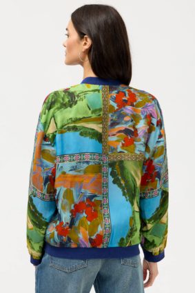 Johnny Was Kim Bomber Jacket Armeria, a luxurious reversible bomber jacket featuring vibrant patchwork-inspired prints, contrasting ribbed trims, and rich jewel-toned floral details.