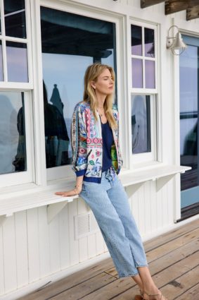 Johnny Was Kim Bomber Jacket Armeria, a luxurious reversible bomber jacket featuring vibrant patchwork-inspired prints, contrasting ribbed trims, and rich jewel-toned floral details.