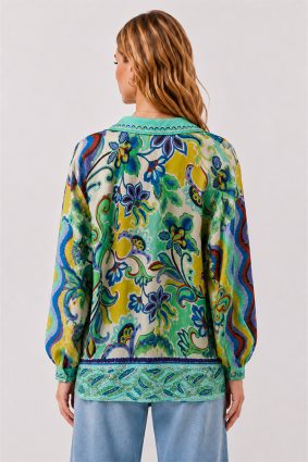 Model wearing the Johnny Was The Audrey Button Up Shirt Rosea, a fluid silk blouse featuring an intricate medley of paisley, floral, and ornamental motifs in aqua, turquoise, cobalt, lime, and golden yellow.