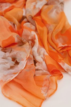 Monari floral print scarf in orange, coral, and blush tones, lightweight viscose fabric