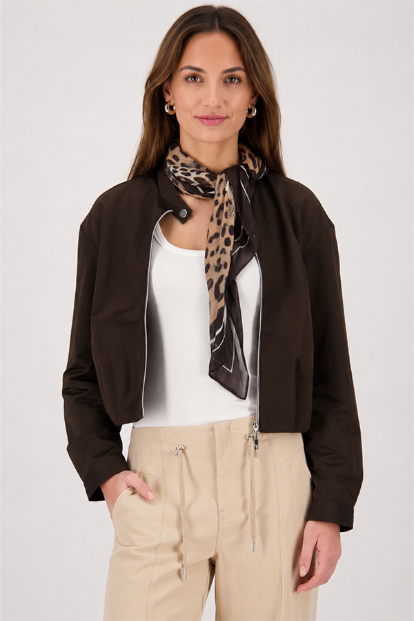 Monari sand-colored leopard print leglet scarf featuring a bold feline motif worn by a model.