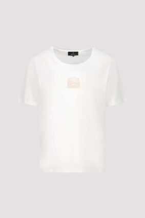 Monari off-white short sleeve t-shirt with a clean silhouette worn by a model.