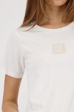Monari off-white short sleeve t-shirt with a clean silhouette worn by a model.