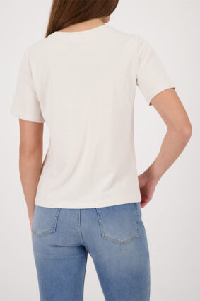 Monari soft beige short sleeve t-shirt with a flattering silhouette worn by a model.