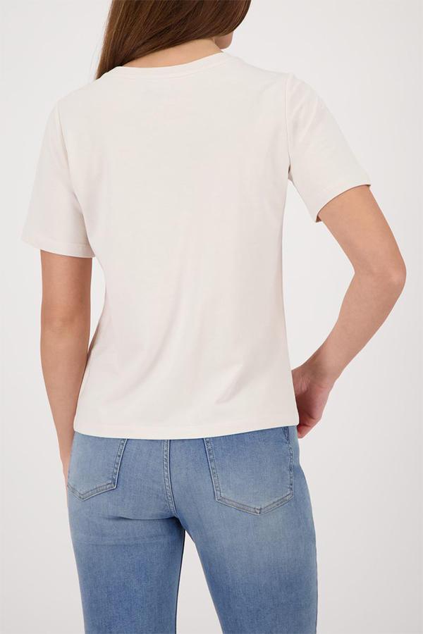 Monari soft beige short sleeve t-shirt with a flattering silhouette worn by a model.