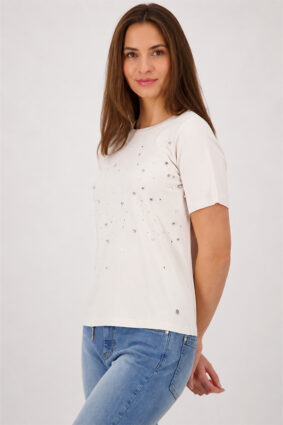 Monari soft beige short sleeve t-shirt with a flattering silhouette worn by a model.