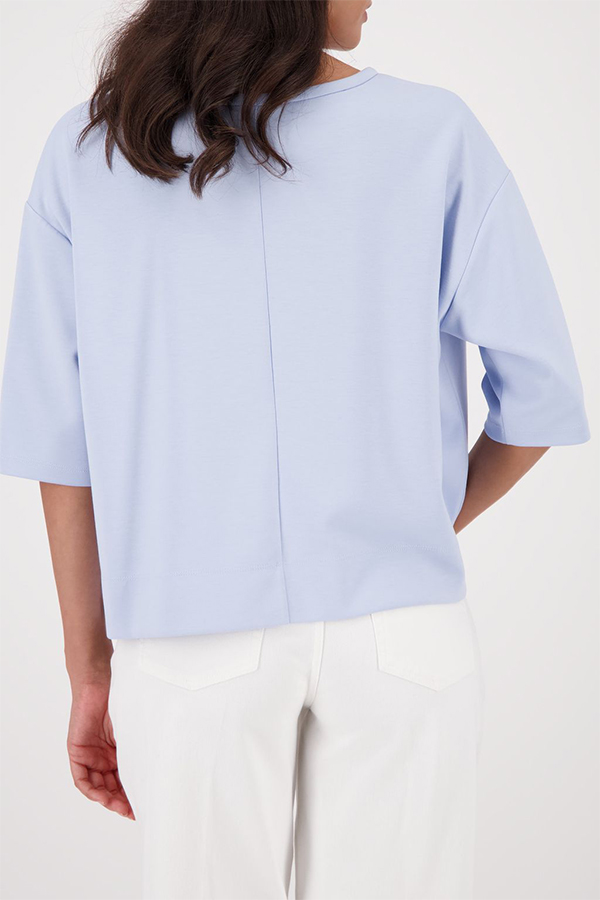 Monari light sky blue jersey top with a relaxed fit and short sleeves worn by a model