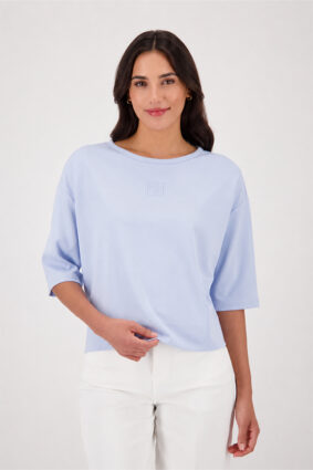 Monari light sky blue jersey top with a relaxed fit and short sleeves worn by a model